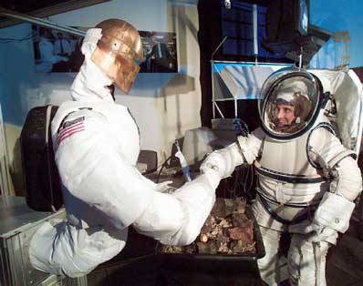 Figure 1. Robonaut is tele-operated to shake hands with an astronaut.